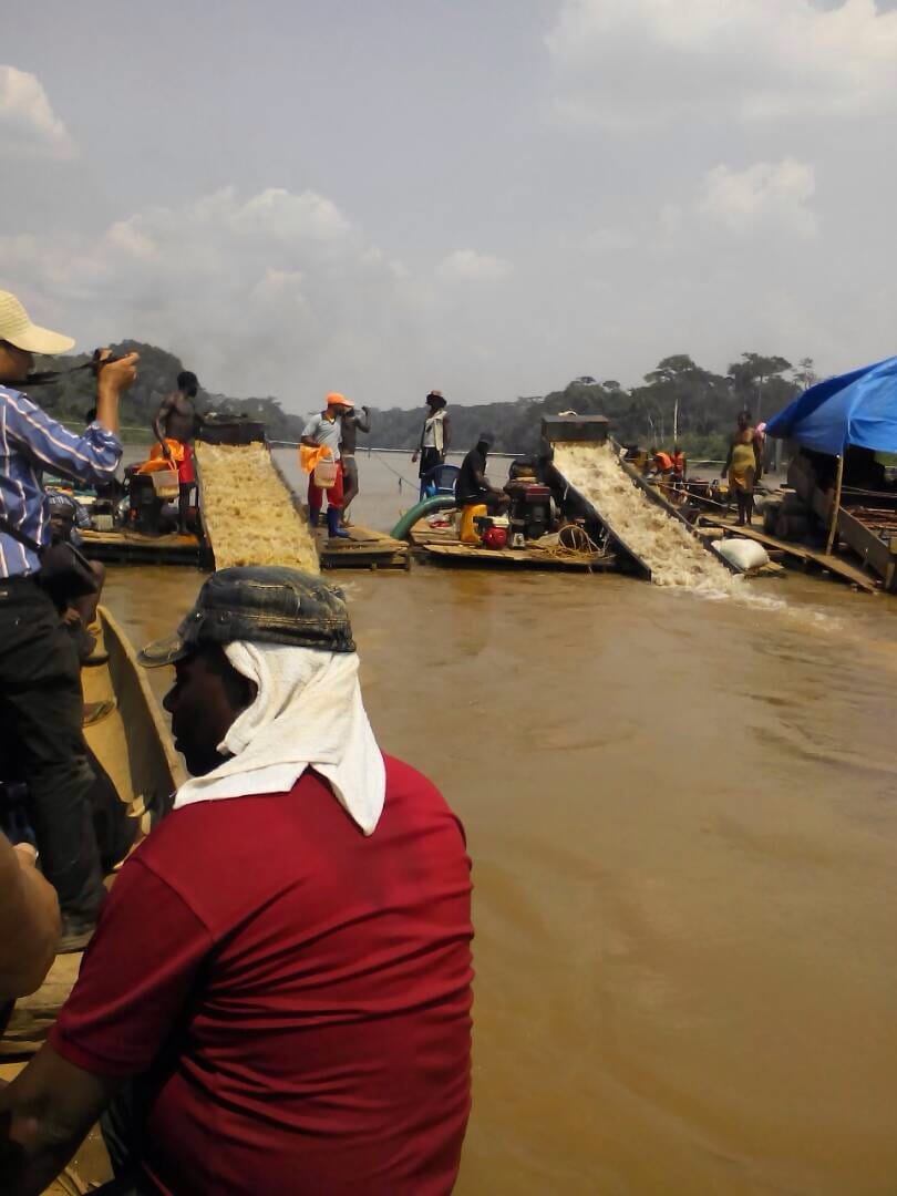 Miners processing sediment